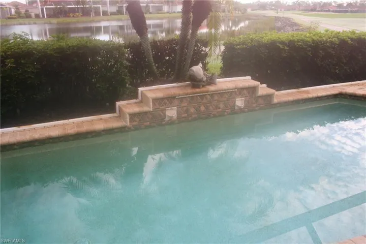 Outdoor pool featuring a water view