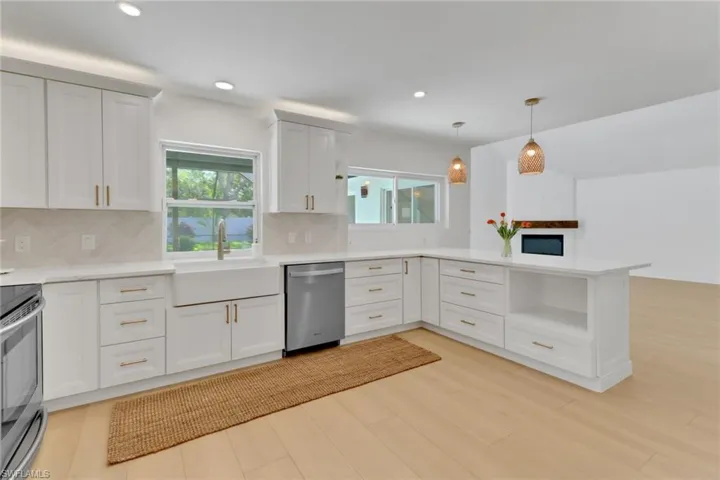 Above cabinet lighting, Stainless steel appliances, under cabinet microwave cabinet.