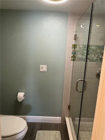 Master shower with frameless glass