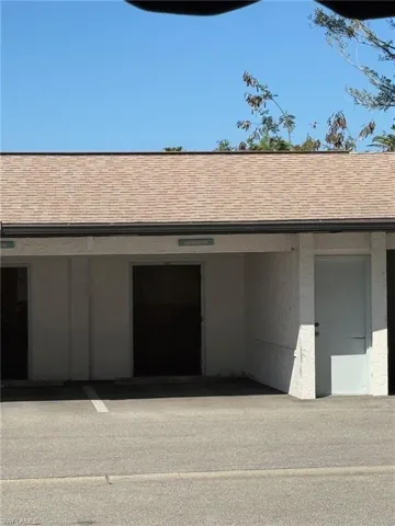 Your covered Carport and storage room right across from the entrance door!