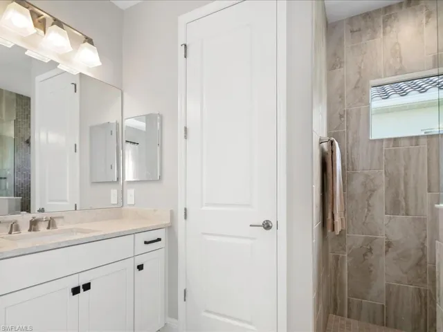 Full bath featuring vanity and walk in shower