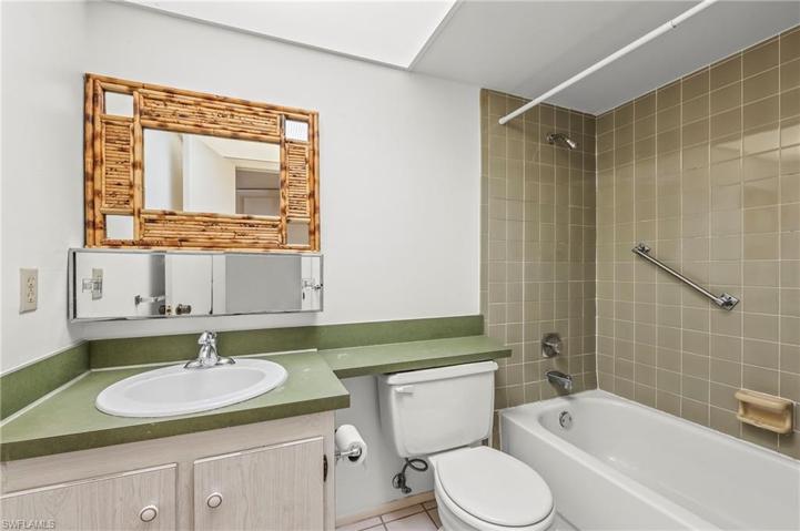 An additional full bath is off the foyer and guest bedroom.