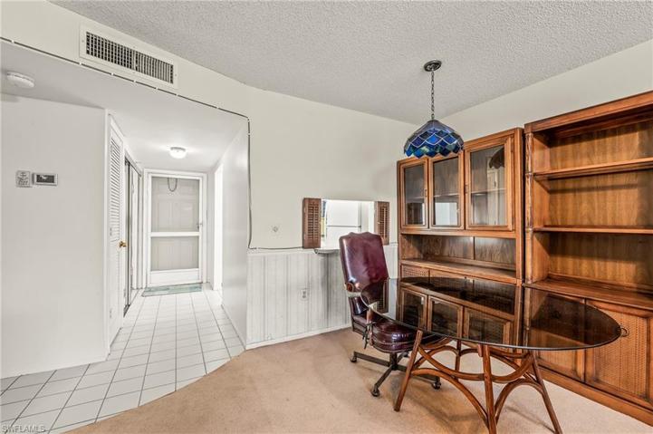 The front door and storage closet on the left is shown from the great room.