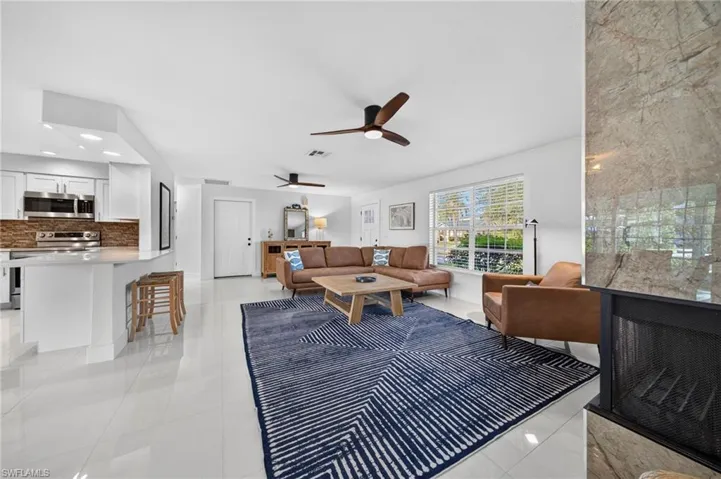 Nice and Bright Great Room with a wood burning fire place.