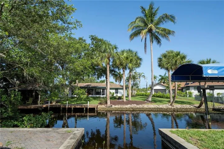 View from across the canal facing the rear of the home.