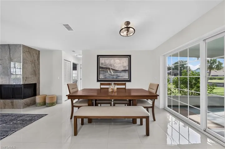 Dining Area off the kitchen and overlooking your large lanai with hurricane glass sliders.