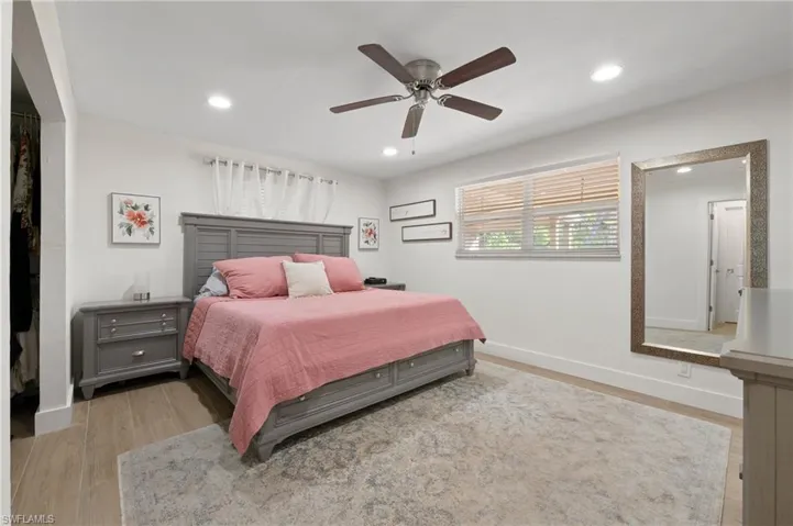 The master bedroom is both spacious and new, and features views outside to the large backyard oasis.