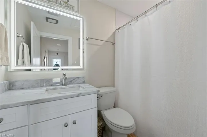The guest bath has been redone as well, and features granite counters and a full size tub.