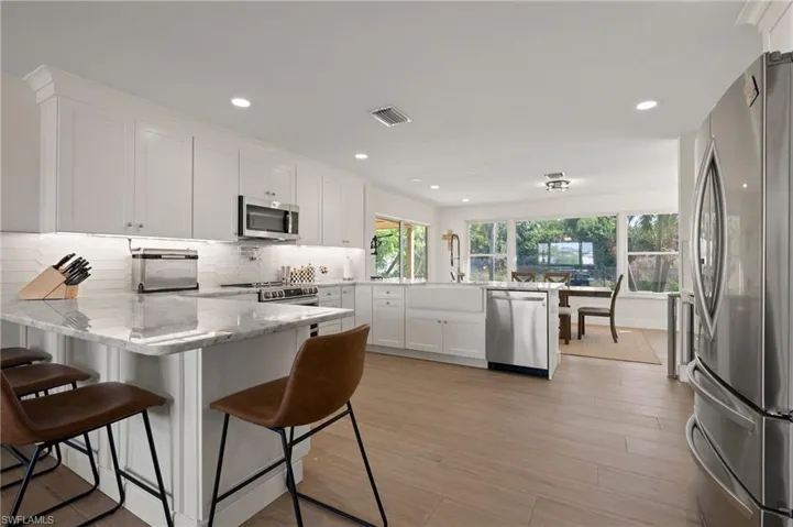 The large kitchen flows from the living room to the dining room.