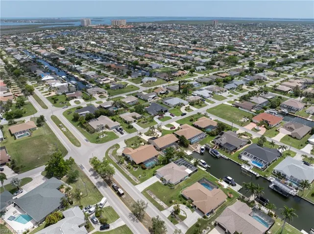 View of property location featuring nearby suburban area and a large body of water