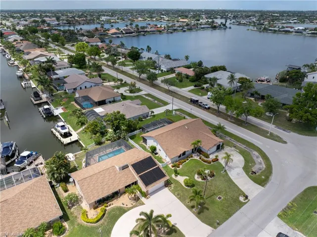 Aerial perspective of suburban area with a large body of water