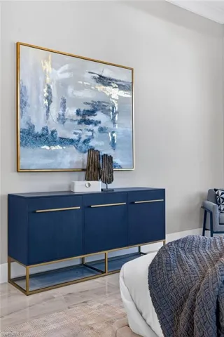 Bedroom with light wood-style floors and baseboards