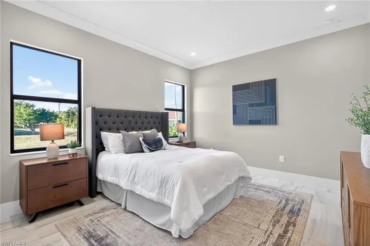 Bedroom featuring crown molding and recessed lighting
