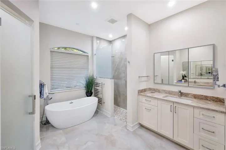Spa inspired finishes make for an elevated primary bathroom
