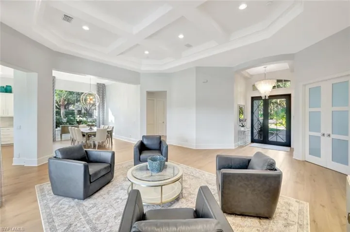 Step into your new Southwest Florida dream home, through a stunning Iron door and into an inviting Foyer