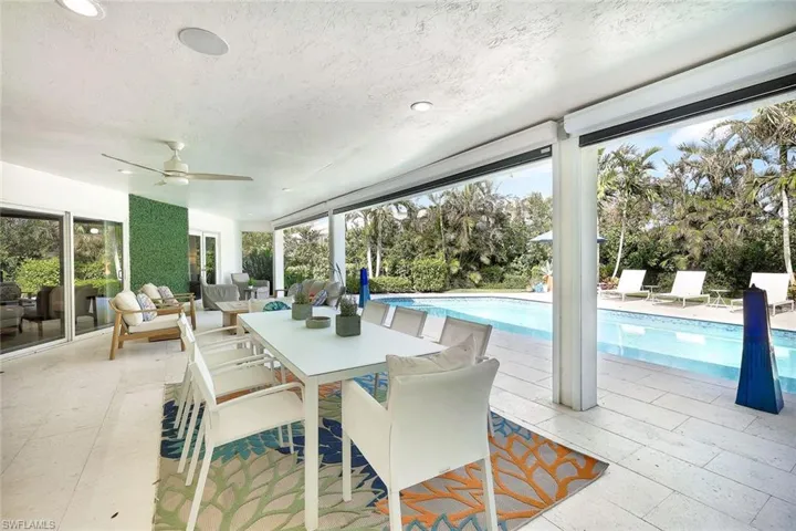 View of patio featuring an outdoor hangout area and ceiling fan
