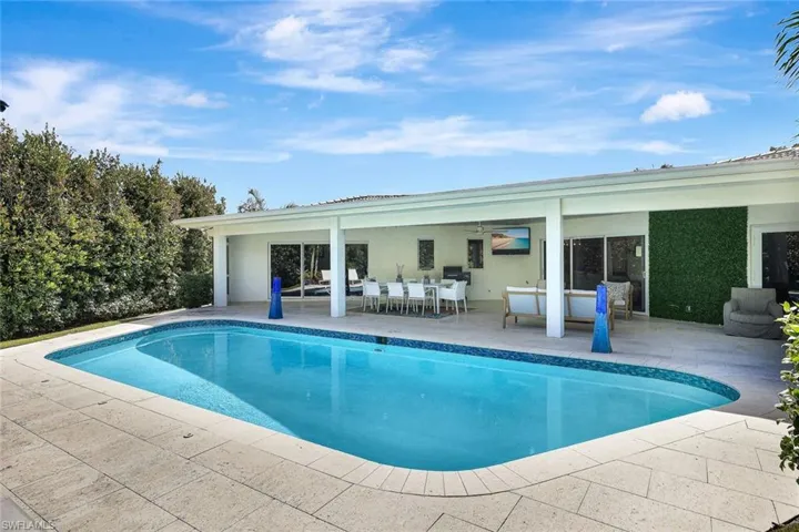 View of pool with an outdoor hangout area, a patio area, and ceiling fan