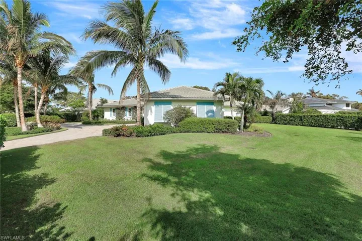 View of front of house with a front yard