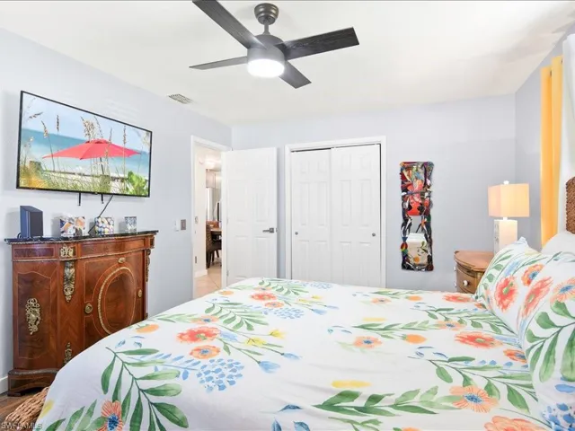 Bedroom featuring ceiling fan and a closet