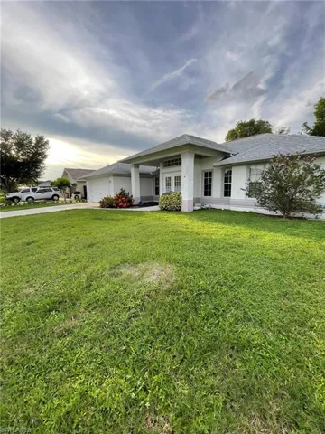View of front of house with a front yard