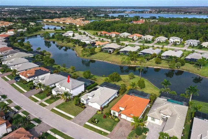 Aerial perspective of suburban area with a nearby body of water