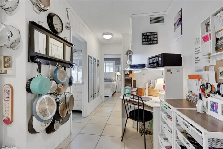 Hallway leading to guest bath, bedrooms; space can accommodate a small home office
