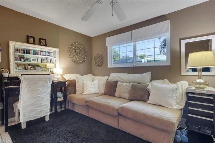 3rd bedroom currently being used as an office/bedroom combo; tile flooring and ceiling fan