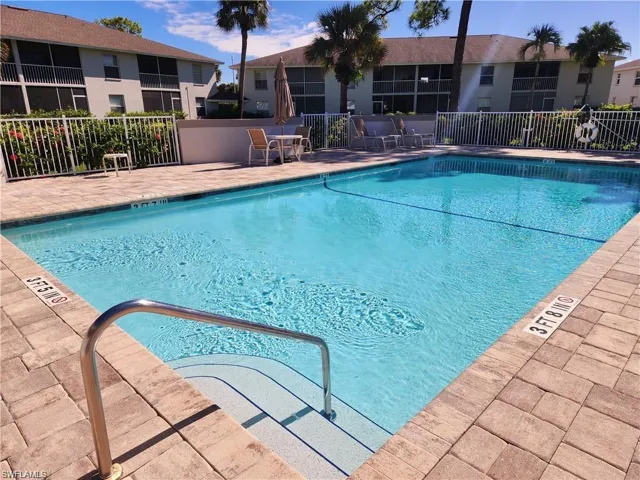 Community pool with a patio area