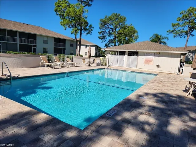 Community pool with a patio area