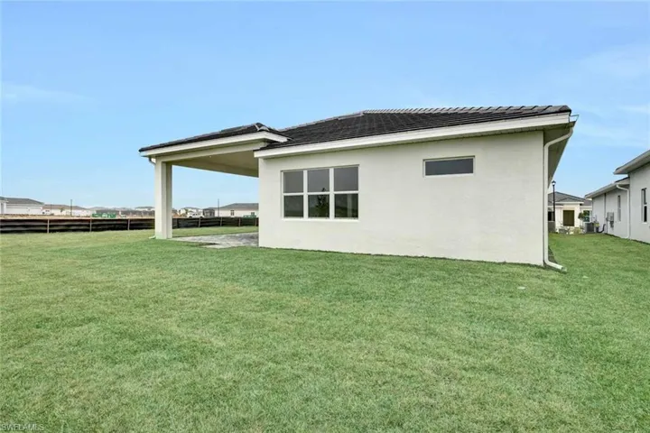 Spacious, covered lanai in backyard