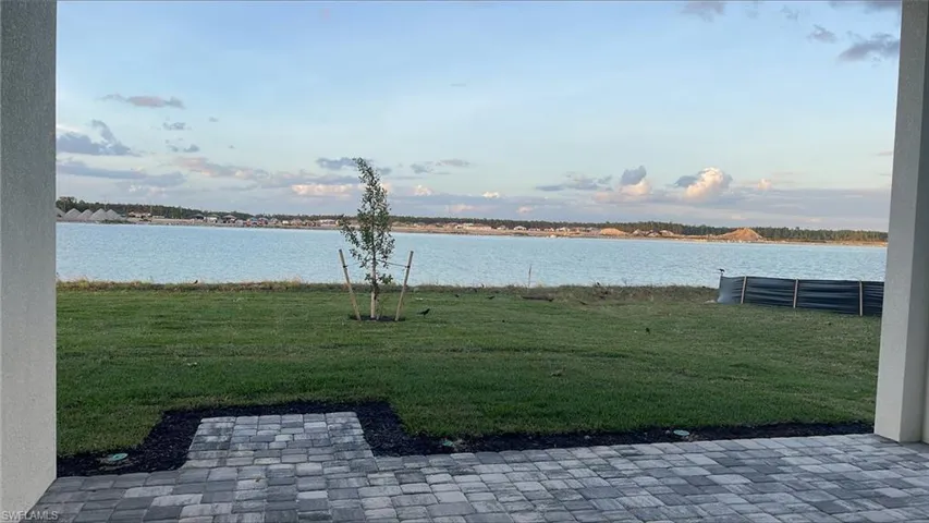 Gorgeous, backyard view during golden hour underneath covered lanai