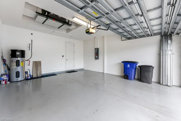 Garage with a garage door opener and water heater