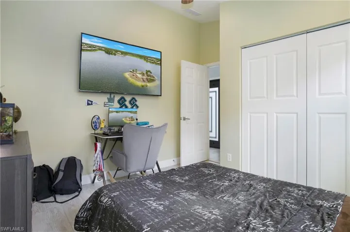 Bedroom featuring hardwood / wood-style flooring and a closet
