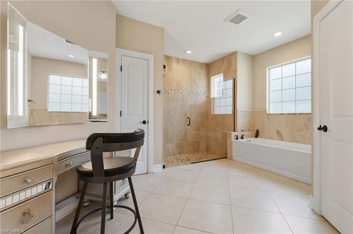 Master bath features seperate tub and shower