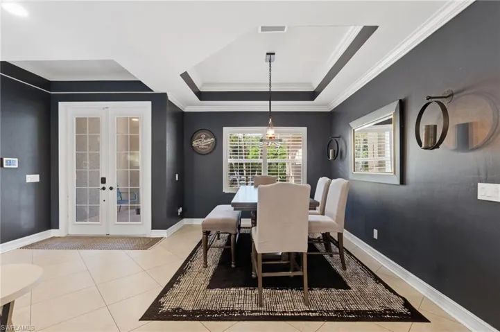 Separate dining area with coffered ceiling