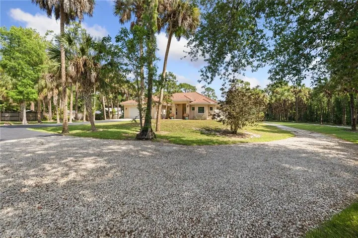 Paved driveway and additional driveway to back of property.