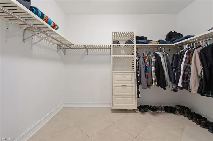 Master suite walkin closet with built-ins