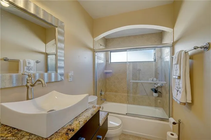 The guest bathroom has a tub/shower combo