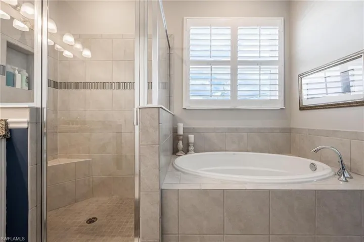 Bathroom featuring plus walk in shower