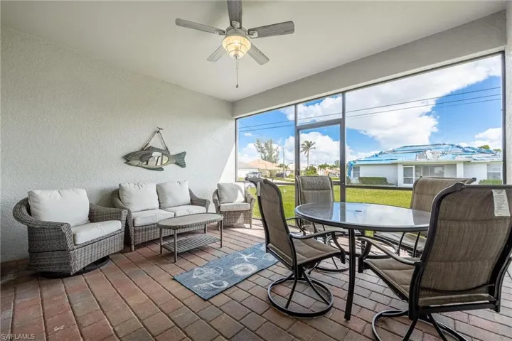 Sunroom / solarium featuring ceiling fan