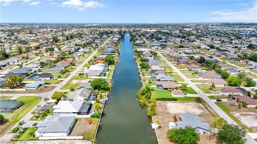 The property is situated along a canal, offering waterfront access