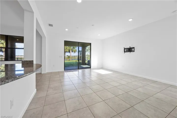 Unfurnished room with light tile patterned floors and recessed lighting