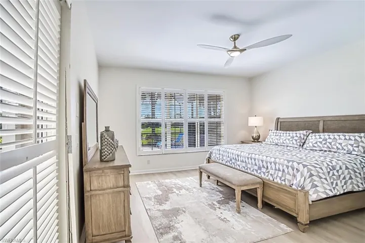 Bedroom featuring light wood-type flooring and ceiling fan