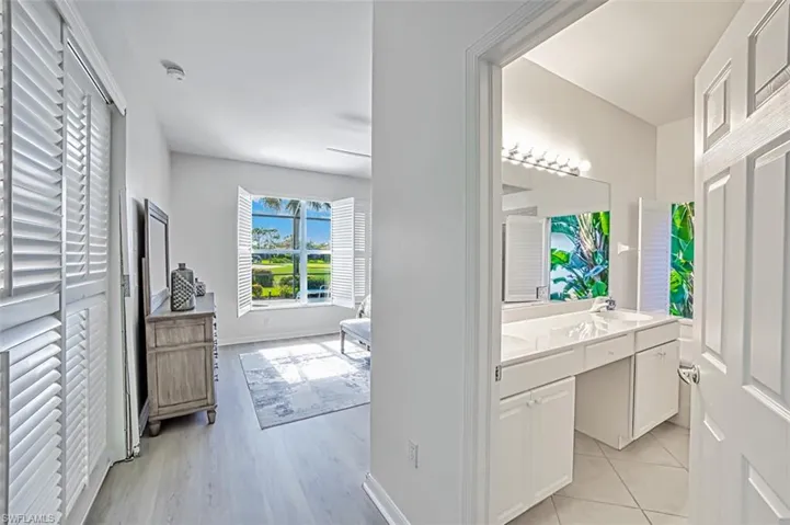 Bathroom with vanity and hardwood / wood-style floors