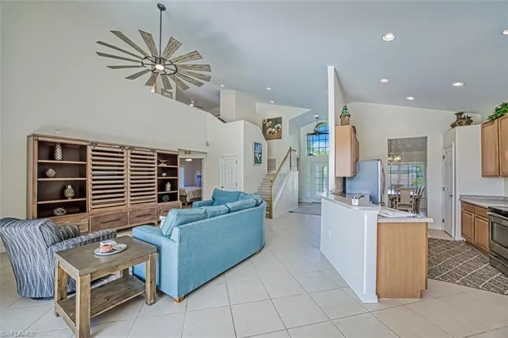Tiled living room with vaulted ceiling