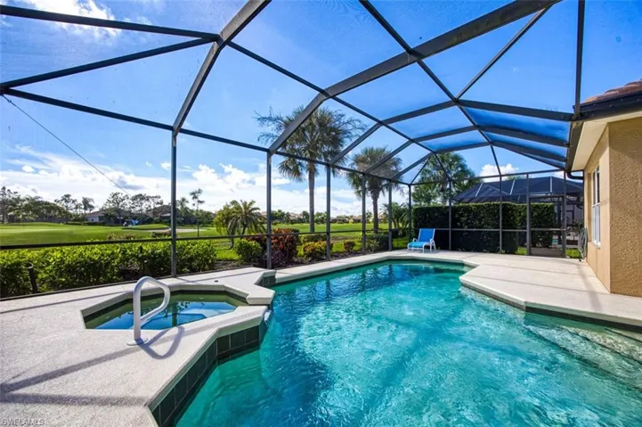 View of pool featuring an in ground hot tub, a lanai, and a patio area