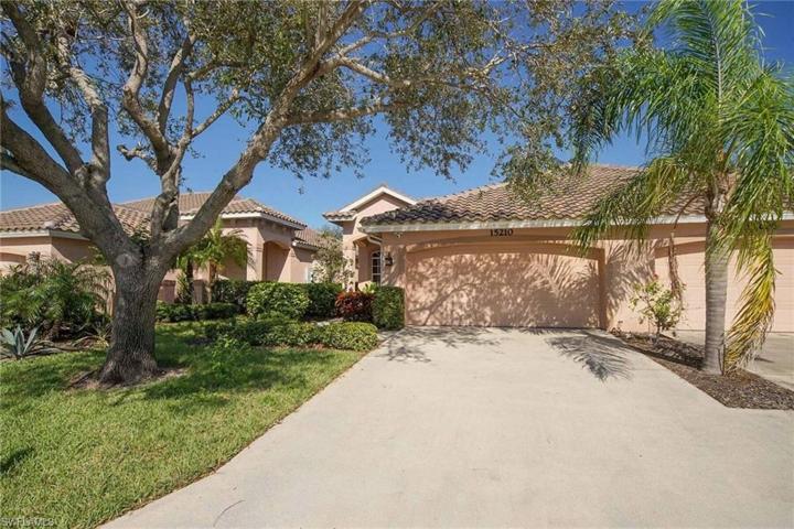 Two car garage with access from a covered Vestibule to your front door.  Barrel Tile Roof 10 yrs.