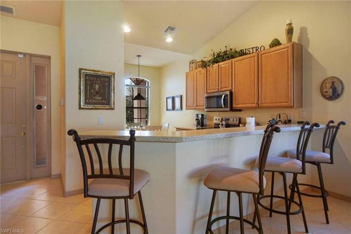 Solid Surfaces with a Snack Bar that seats 4. Barstools convey