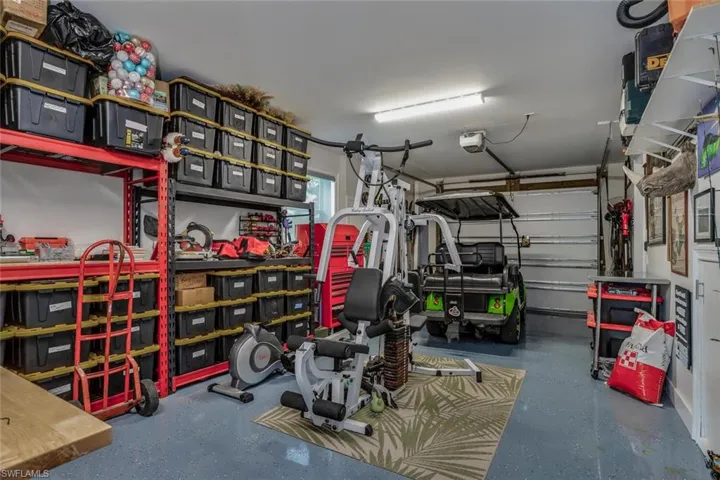 View of garage and garage door opener