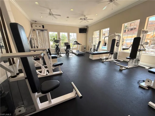 Gym with recessed lighting, baseboards, crown molding, and ceiling fan